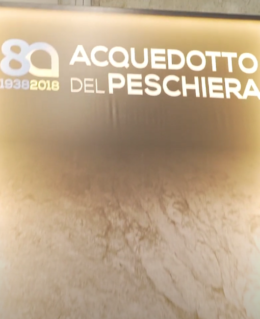 Poster dell'evento per gli 80 anni dell'acquedotto del peschiera