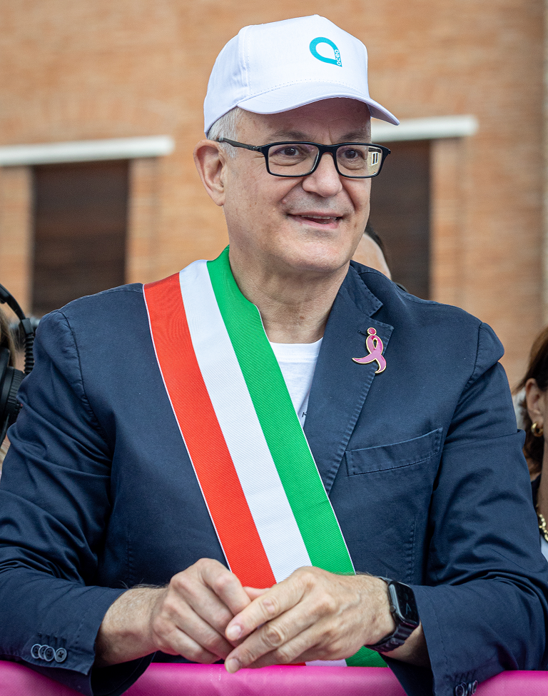 Roberto Gualtieri, Mayor of Rome takes part in the Race for the Cure. He is wearing the Italian flag sash, the baseball cap with the Acea logo on it and and a pin of the logo of Komen Italia