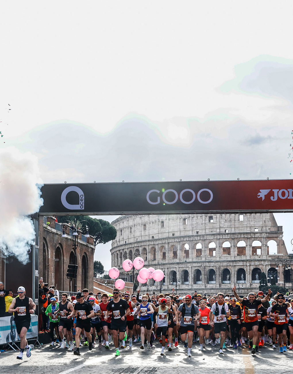 athletes at the starting line of the 2026 Acea Run Rome Marathon, with the Colosseum in the background