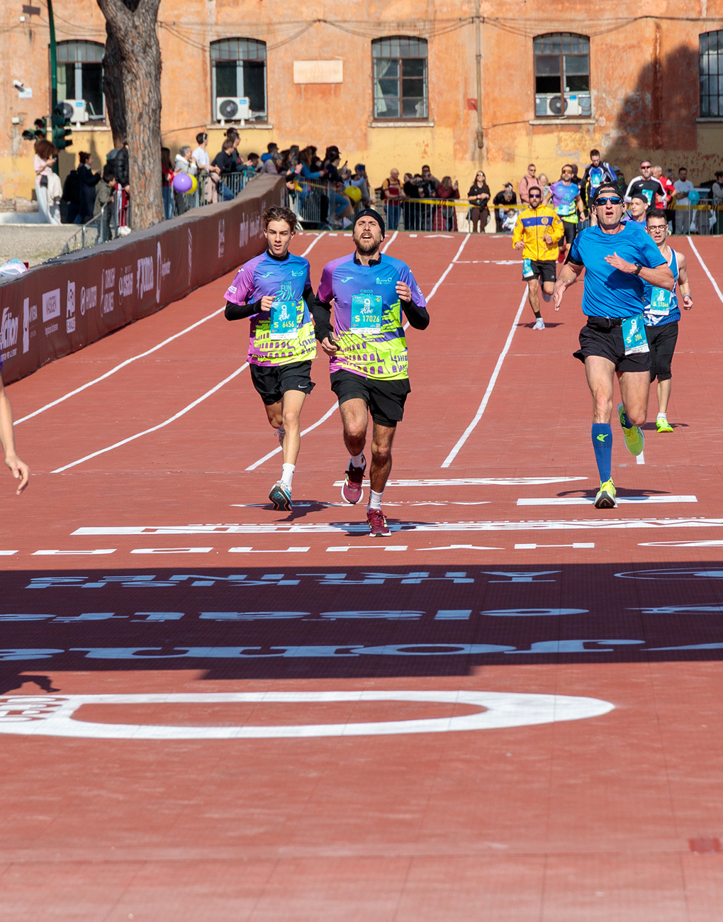 Two athletes cross the finish line at the Acea Run Rome The Marathon 2026